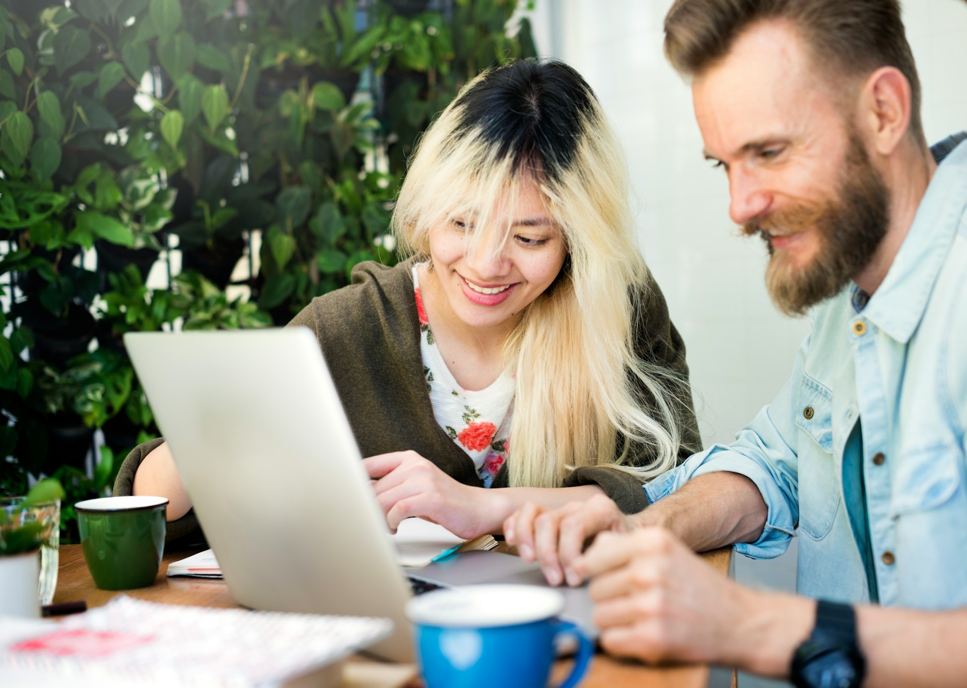 A first home buyer and her partner exploring their options together on a laptop